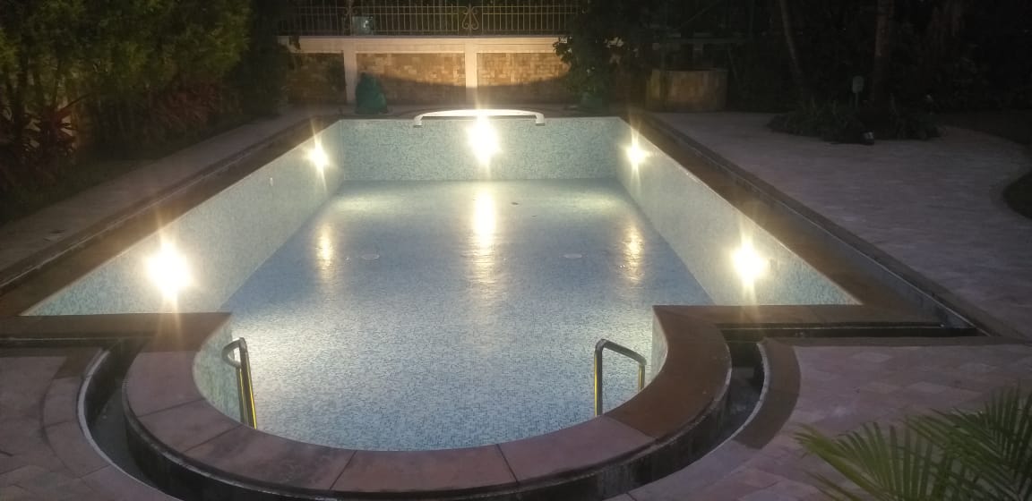 Night lit villa pool